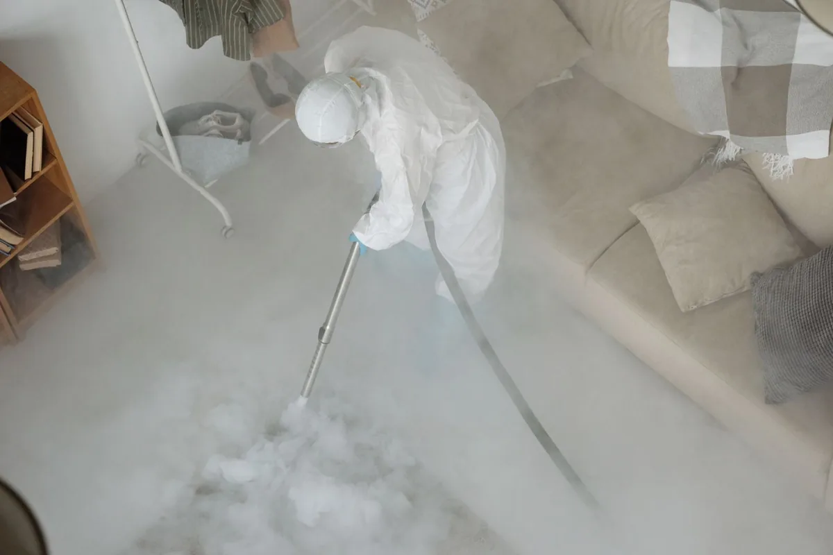 Biohazard cleanup technician in protective equipment, Tornillo, TX